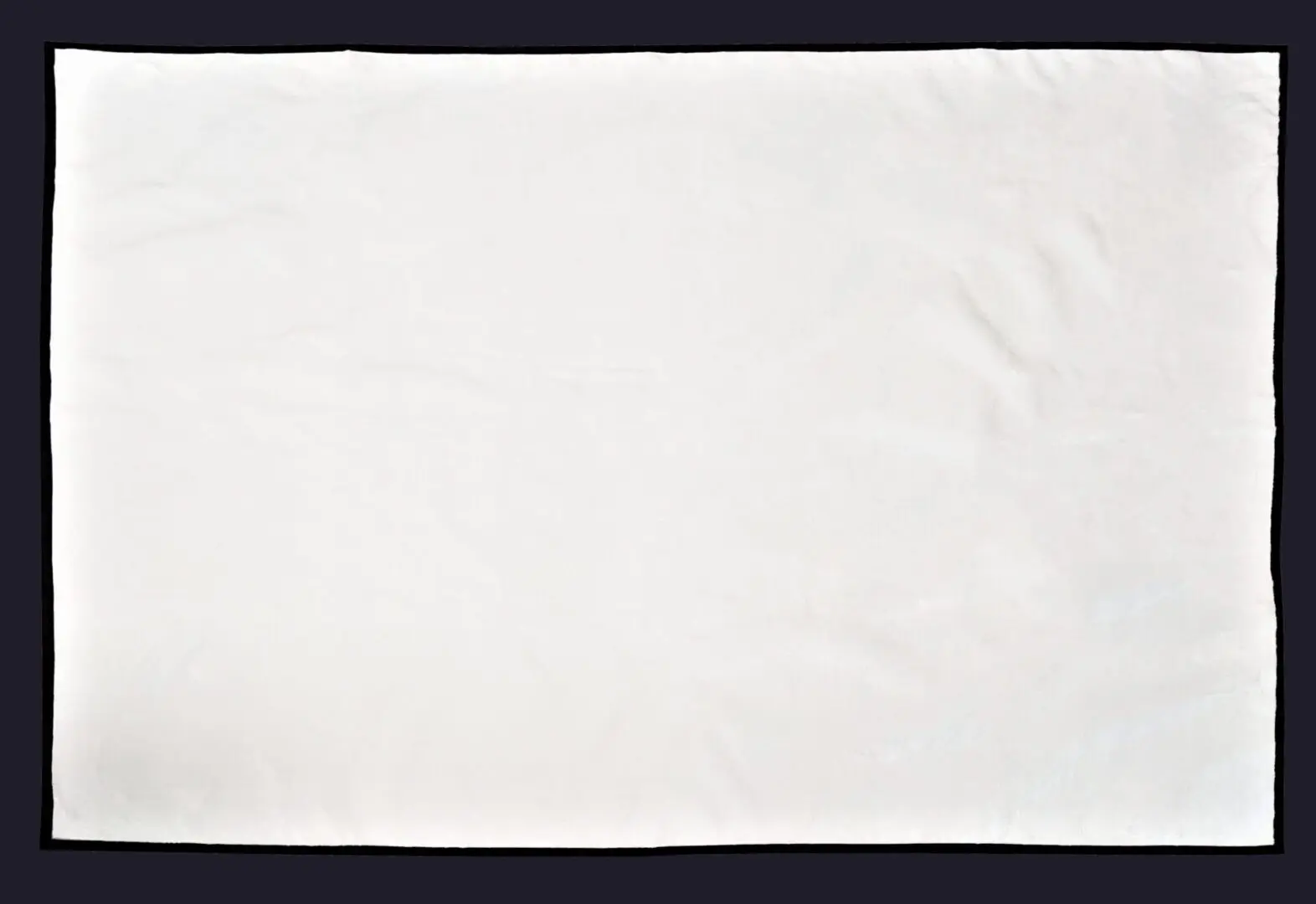 A white colored cotton picnic blanket