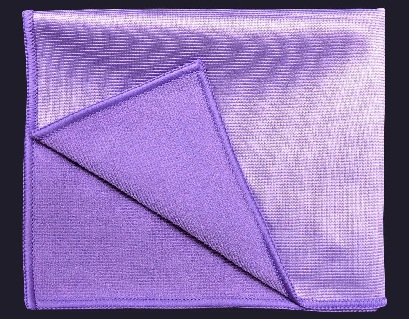Lavender color cloth folded on navy blue background