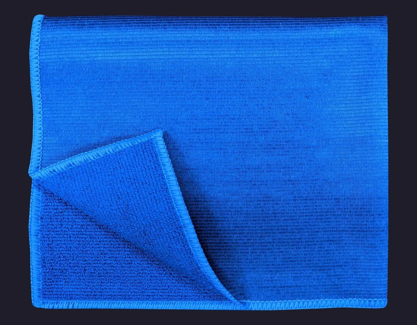Blue color cloth folded on navy blue background
