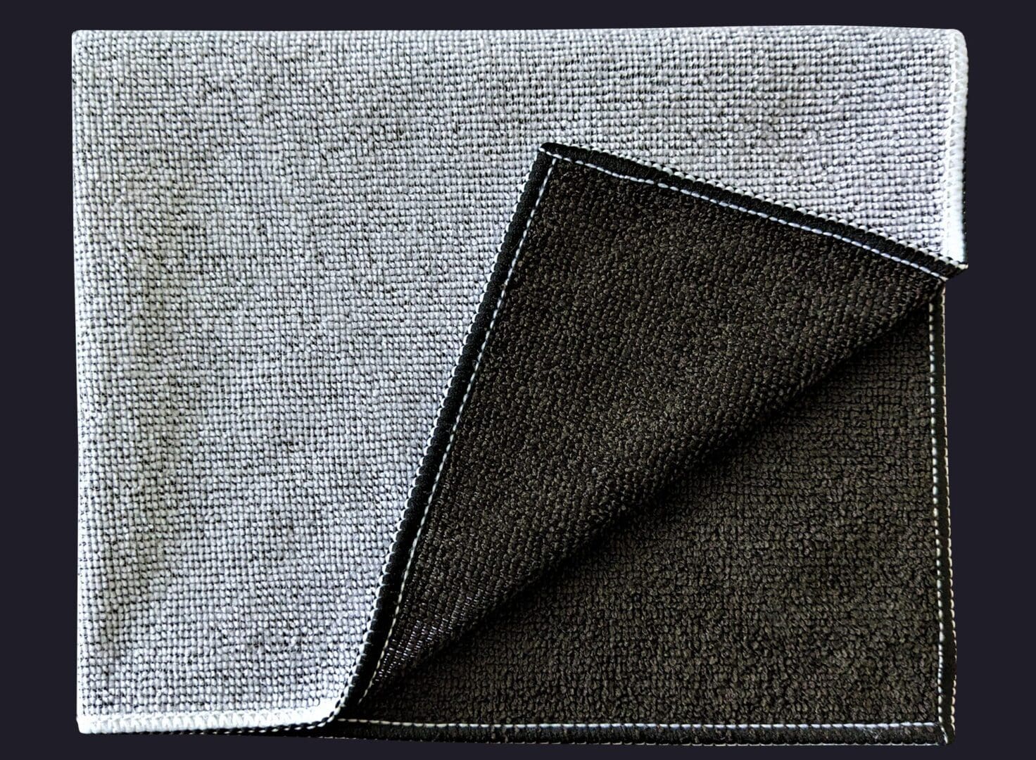 Block cloth folded in black on blue color background
