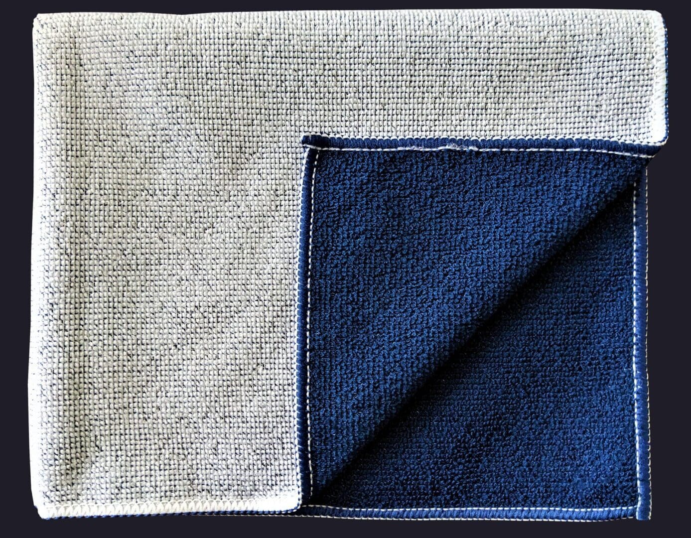 Blue color cloth folded in on black background